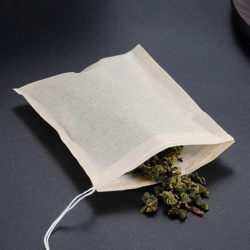 Tare buste da tè biodegradabili in carta biodegradabili con stringa guarni di guarigione per tè a foglia sciolta a foglia sciolta.