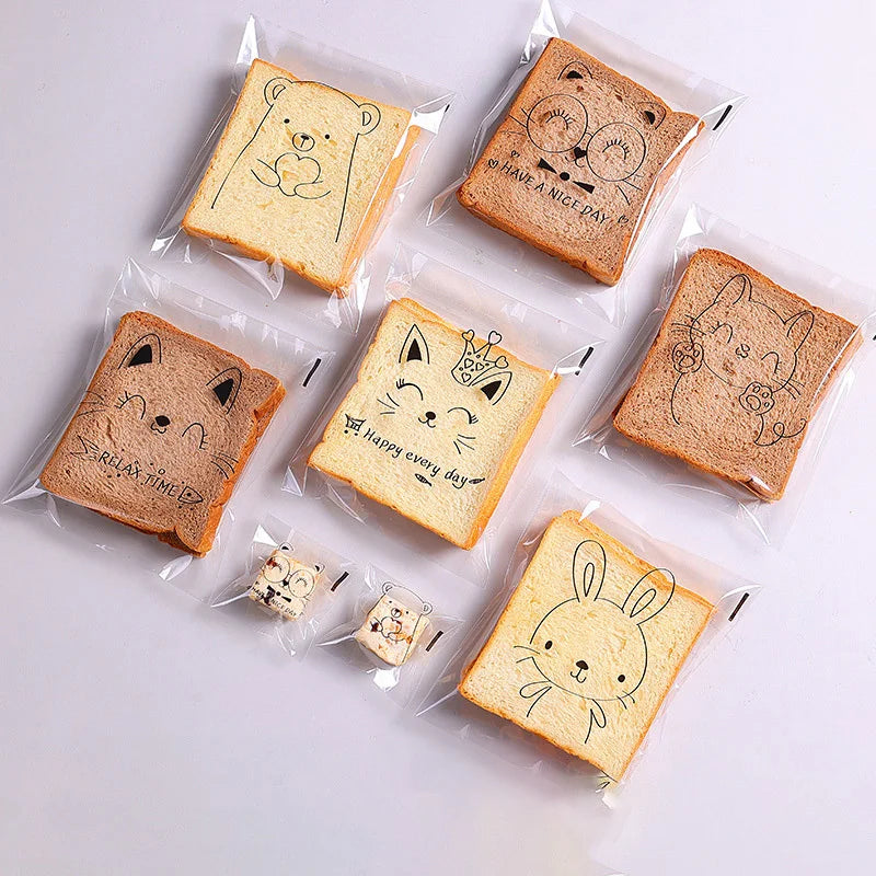 50/100pcs bolsas de regalo de dulces autoadhesivas transparentes Lindas galletas de pan de pan de conejito Tosto para hornear suministros