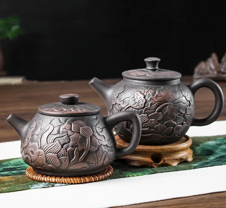 ييشينغ براد شاي الأرجواني الطين إبريق الشاي الجمال غلاية الطين الأسود اليد منحوتة لوتس التوضيح وعاء المنزل اليدوية طقم شاي