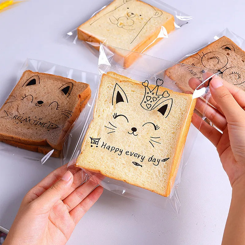 50/100pc: n läpinäkyvä itselähtävät karkkilahjapussit söpö pupu Cat Bear Animal Leipä paahtoleipää leivontapakkauslaukkuja