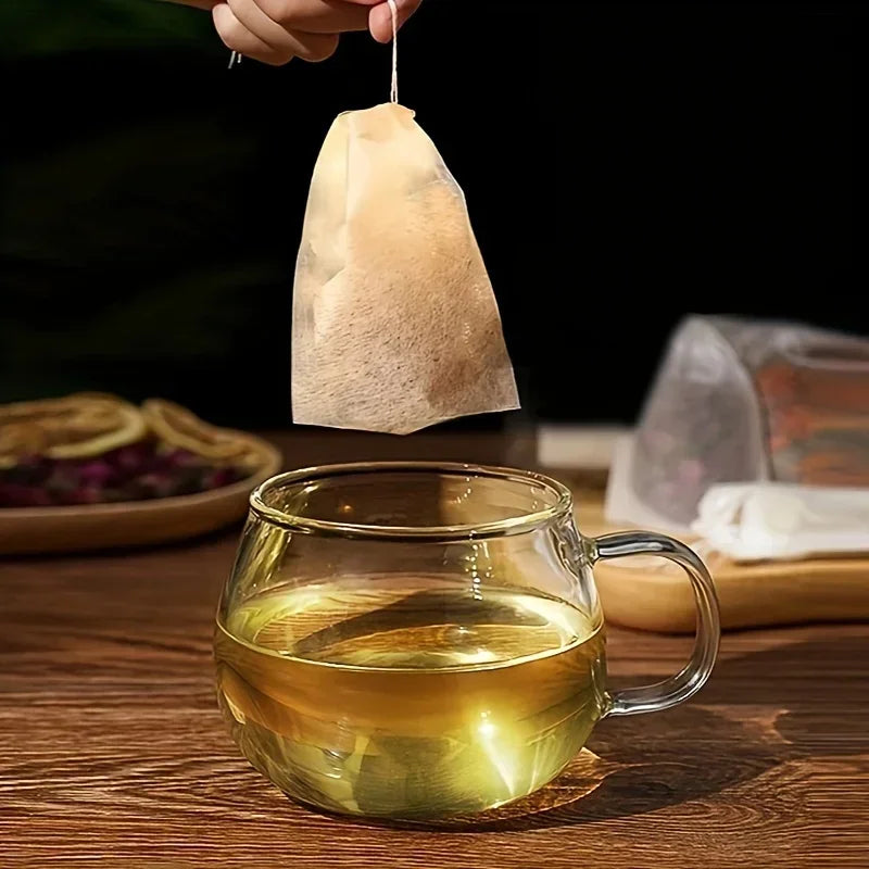 Massor engångs tepåsar Biologiskt nedbrytbara papperstefilterväskor med strängläkning Tätning Tomt dragskonkryddor Loose Leaf Tea Powder