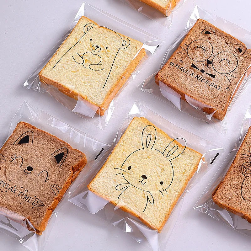 50/100pcs 투명한 자기 접근성 사탕 선물 가방 귀여운 토끼 고양이 곰 동물 빵 토스트 쿠키 베이킹 포장 가방 용품