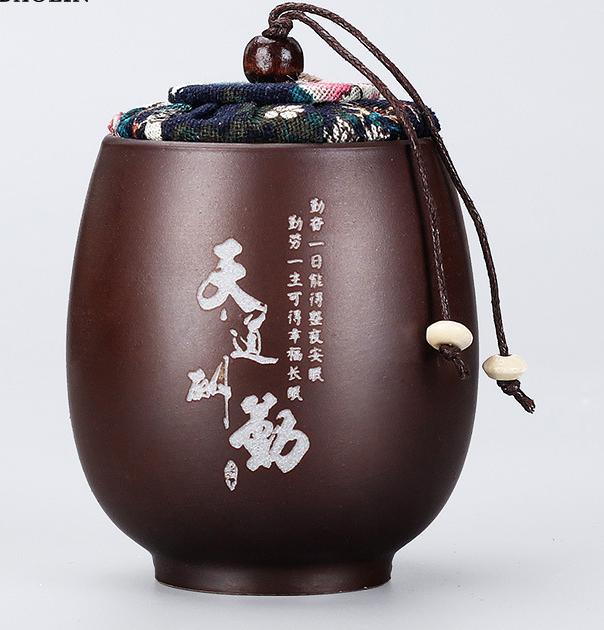 علبة شاي بأحرف صينية من الطين الأرجواني