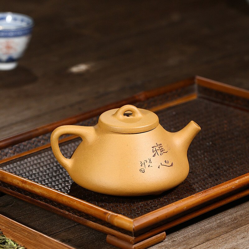 Théière en argile dorée Fengming Ore faite à la main de Yixing