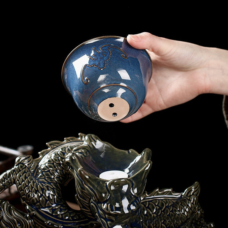 Juego de té Dragon Ceramics con infusor de té giratorio semiautomático